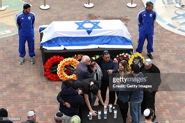 The Israeli flag covers the coffin of footballer Avi Cohen during a funeral service attended by hundreds of mourners at a football stadium on...
