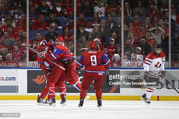 Maxim Kitsyn of Russia celebrates his goal with teammates during the 2011 IIHF World U20 Championship Group B game between Canada and Germany on...