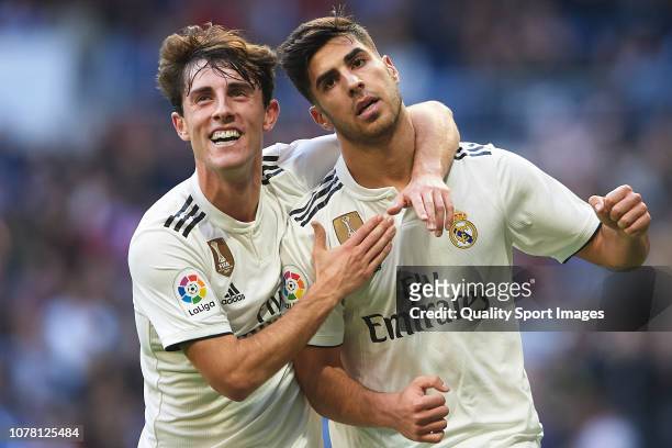 Marco Asensio of Real Madrid celebrates after scoring his team's first goal with Alvaro Odriozola during the Spanish Copa del Rey second leg match...