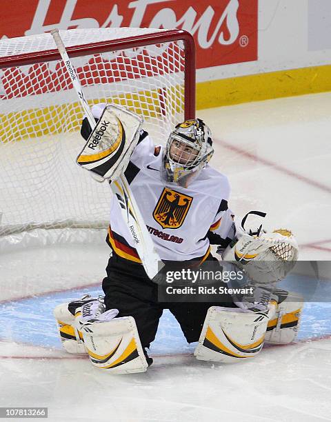 Philipp Grubauer of Germany watches his deflection against Finland during the 2011 IIHF World U20 Championship game between Germany and Finland at...