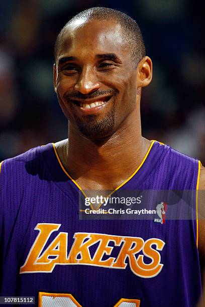 Kobe Bryant of the Los Angeles Lakers smiles near the end of the game against the New Orleans Hornets at the New Orleans Arena on December 29, 2010...