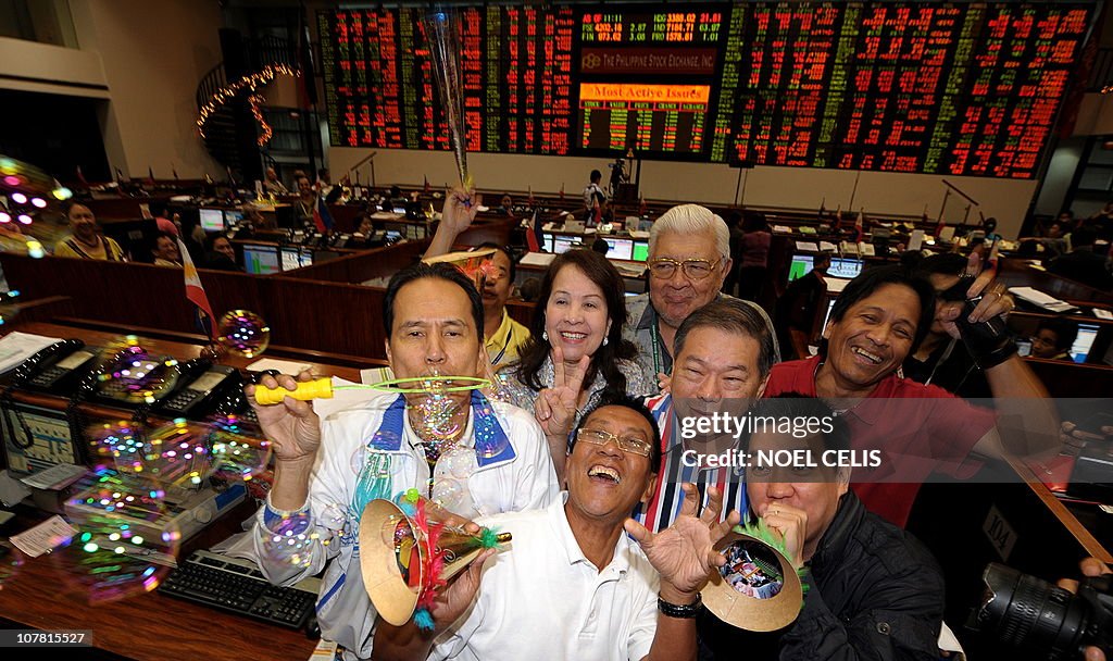 Philippine Stock Exchange traders celebr