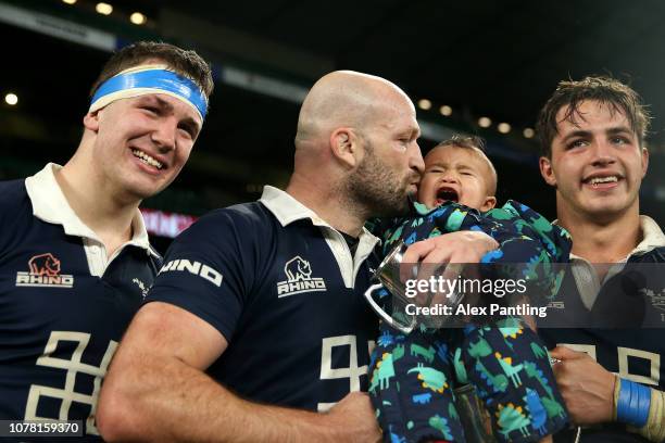 George Robson of Oxford celebrates victory with his baby following the Oxford University vs Cambridge University Varsity match at Twickenham Stadium...