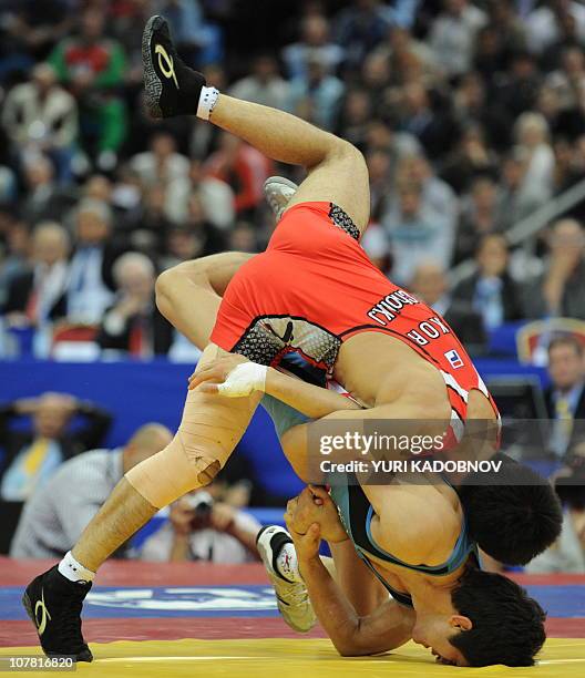 Gyu-Jin Choi of Korea vies with Hamid Soryan of Iran during their 55 kg Greco-Roman final at the World Wrestling Championships in Moscow on September...