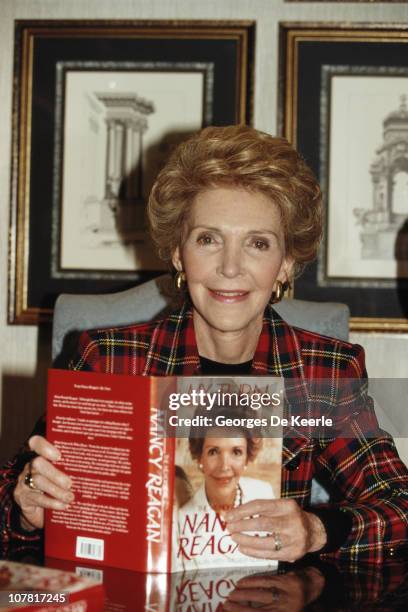 Nancy Reagan, the wife of former US President Ronald Reagan, with her autobiography 'My Turn', 1989.