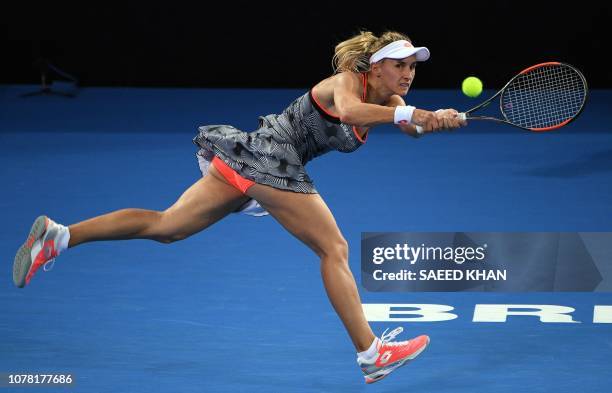 Lesia Tsurenko of Ukraine hits a return against the Czech Republic's Karolina Pliskova during their women's singles final match at the Brisbane...