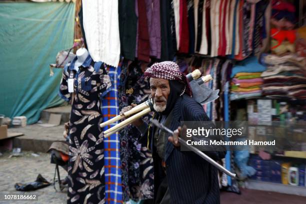 Yemeni man walks at a market in the Sana’a Old City on December 06, 2018 in Sana’a, Yemen. Yemen’s warring factions have opened their first peace...