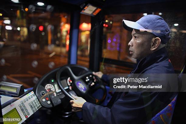Bus driver Chitpinit Kaewchaluay drives the 762 night bus on December 15, 2010 in London, England. Chitpinit will drive the night bus from midnight...