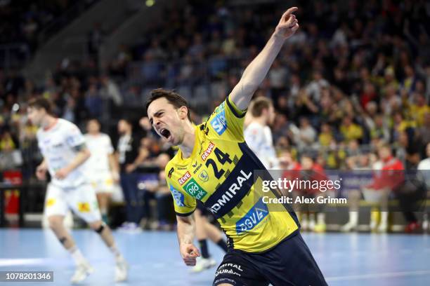 Patrick Groetzki of Rhein-Neckar Loewen celebrates a goal during the DKB HBL match between RN Loewen and SC Magdeburg at SAP Arena on December 06,...