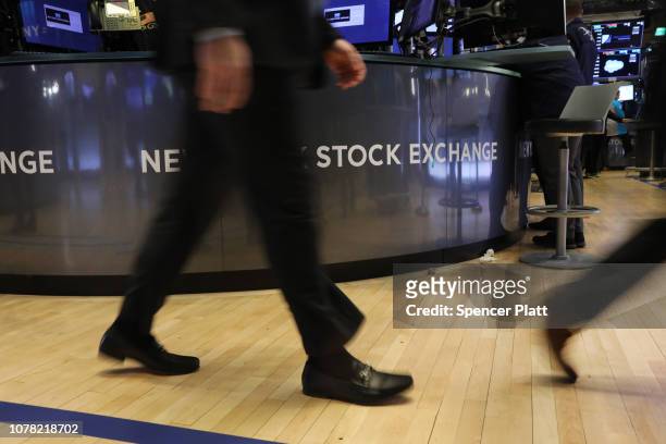 Traders work on the floor of the New York Stock Exchange before the Closing Bell on December 06, 2018 in New York City. The Dow Jones industrial...