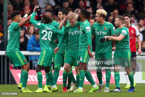 Will Hughes of Watford celebrates with teammates after scoring his team's first goal during the FA Cup Third Round match between Woking and Watford...