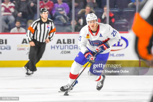 Michael McCarron of the Laval Rocket in control of the puck against the Belleville Senators at Place Bell on November 28, 2018 in Laval, Quebec.