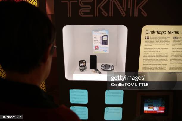 Visitor looks at a display on unssuccessful technological products, including the Twitter Peek, a hand-held device that only supporter Twitter, at...