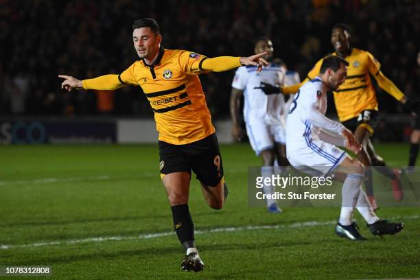 Padraig Amond of Newport County celebrates after scoring his team's second goal from the penalty spot during the FA Cup Third Round match between...