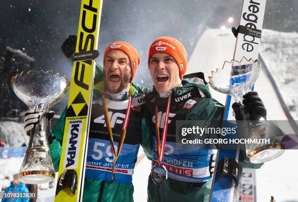 Germany's Markus Eisenbichler and Stephan Leyhe celebrate after the Four-Hills Ski Jumping tournament , in Bischofshofen, Austria, on January 6,...