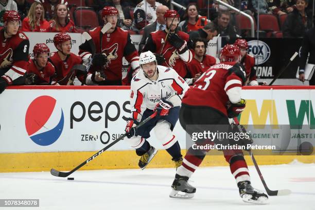 Alex Ovechkin of the Washington Capitals skates with the puck against Oliver Ekman-Larsson of the Arizona Coyotes during the third period of the NHL...