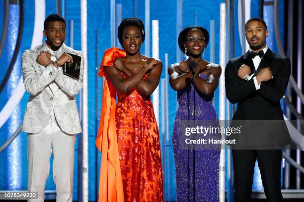 In this handout photo provided by NBCUniversal, Presenters Chadwick Boseman, Danai Gurira, Lupita Nyong'o and Michael B. Jordan speak onstage during...