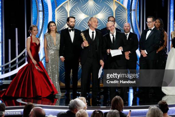 In this handout photo provided by NBCUniversal, Joe Weinberg from “The Americans” accept the Best Television Series – Drama award onstage during the...
