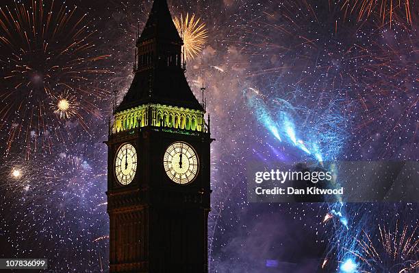 Fireworks light up the London skyline and Big Ben just after midnight on January 1, 2011 in London, England. Thousands of people lined the banks of...