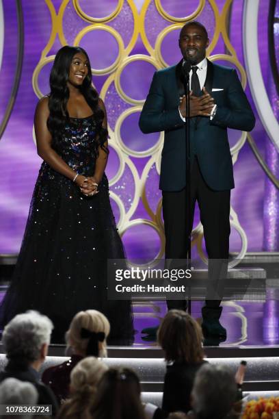 In this handout photo provided by NBCUniversal, Idris Elba presents Miss Golden Globe 2019 Isan Elba onstage during the 76th Annual Golden Globe...