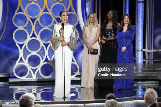 In this handout photo provided by NBCUniversal, Sandra Oh from “Killing Eve” accept the Best Performance by an Actress in a Television Series – Drama...