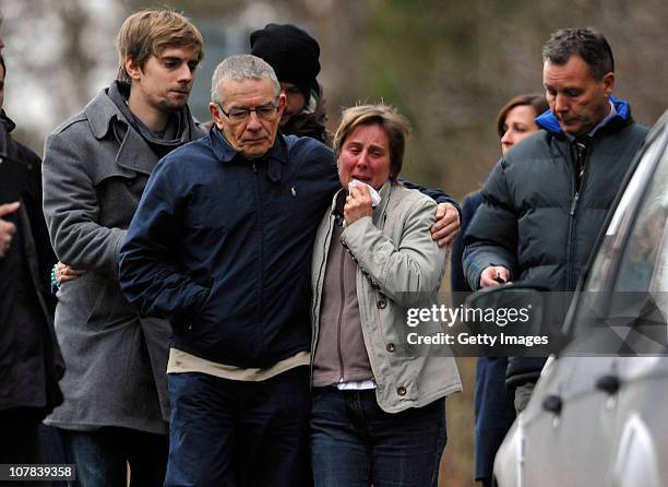 The family of Joanna Yeates, Theresa Yeates is hugged by David Yeates with brother Chris as they visit Longwood Lane, to lay flowers where the body...