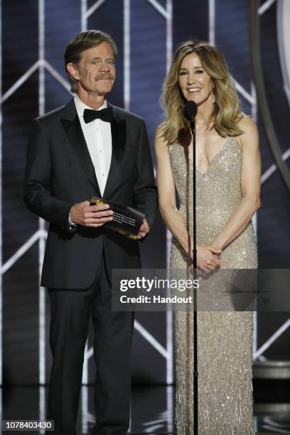 In this handout photo provided by NBCUniversal, Presenters William H. Macy and Felicity Huffman speak onstage during the 76th Annual Golden Globe...