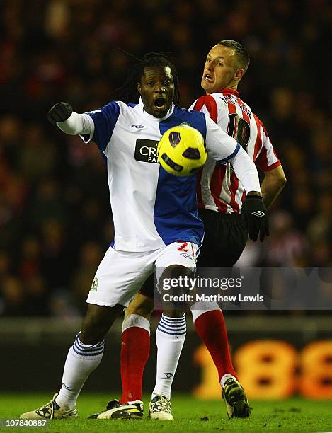 Mwaruwari Benjani of Blackburn and David Meyler of Sunderland challenge for the ball during the Barclays Premier League match between Sunderland and...