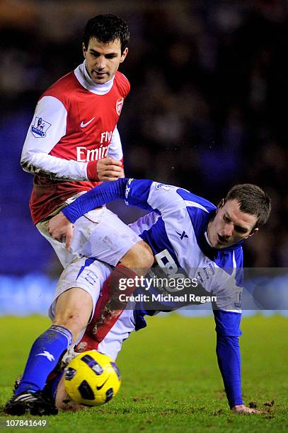 Cesc Fabregas of Arsenal is tackled by Craig Gardner of Birmingham during the Barclays Premier Leaue match between Birmingham City and Arsenal at St....