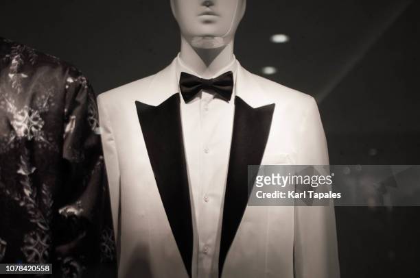 mannequin of female likeness on a store window - dinner jacket stock pictures, royalty-free photos & images