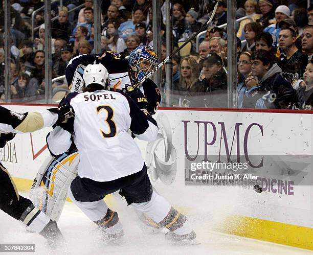 Ondrej Pavelec of the Atlanta Thrashers clears the puck against the Pittsburgh Penguins at Consol Energy Center on December 28, 2010 in Pittsburgh,...