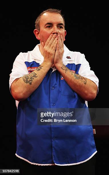 Phil Taylor of England reacts during his match against Mark Webster of Wales during the quarter finals of the 2011 Ladbrokes.com World Darts...