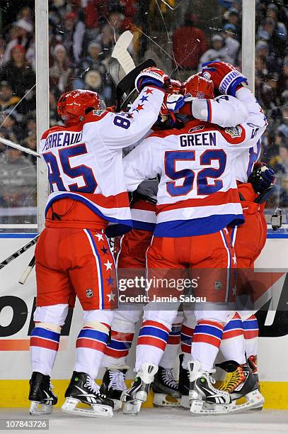 The Washington Capitals celebrate a goal by teammate Mike Knuble during the second period of the game against the Pittsburgh Penguins at the 2011 NHL...