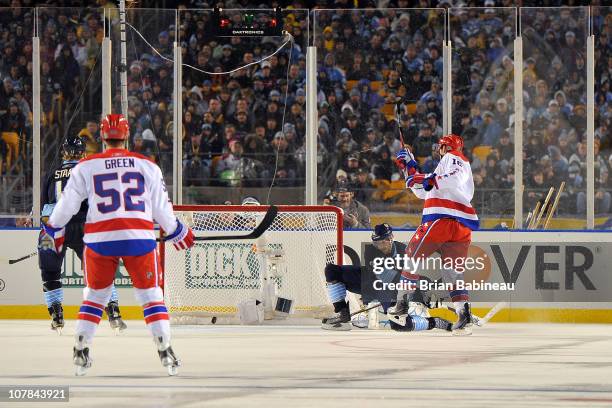 Eric Fehr of the Washington Capitals scores a goal against the Pittsburgh Penguins in the 2nd period during the 2011 NHL Bridgestone Winter Classic...