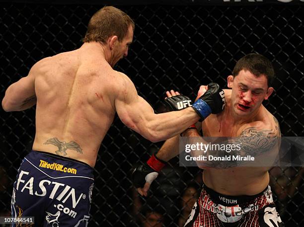 Gray Maynard punches Frankie Edgar at UFC 125: Resolution at the MGM Grand Garden Arena on January 1, 2011 in Las Vegas, Nevada.