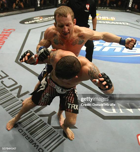 Gray Maynard punches Frankie Edgar at UFC 125: Resolution at the MGM Grand Garden Arena on January 1, 2011 in Las Vegas, Nevada.