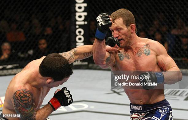 Gray Maynard punches Frankie Edgar at UFC 125: Resolution at the MGM Grand Garden Arena on January 1, 2011 in Las Vegas, Nevada.