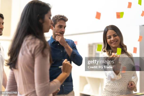 team working from sticky notes - design thinking stock pictures, royalty-free photos & images