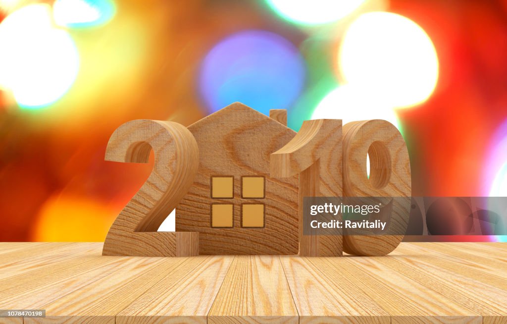 Wooden 2019 with house icon and bokeh lights