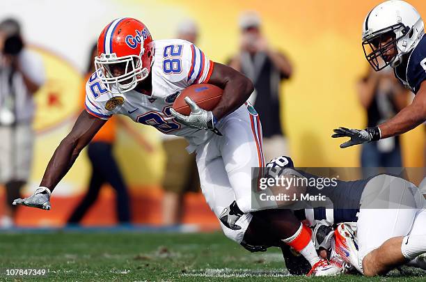 Receiver Omarius Hines of the Florida Gators is tackled by defender Drew Astorino of the Penn State Nittany Lions during the Outback Bowl at Raymond...