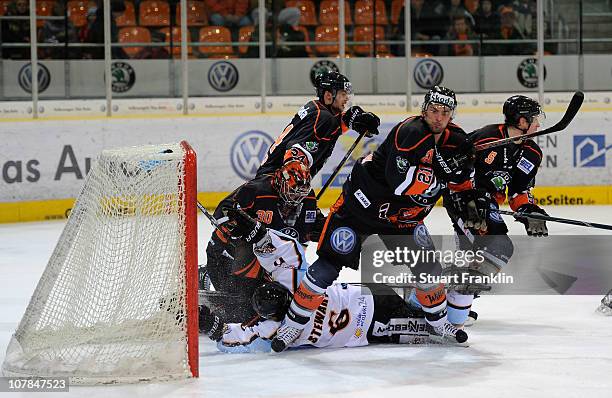 Daniar Dshunussow of Wolfsburg saves a shot by Karl Stewart of Straubing during the DEL match between Grizzly Adams Wolfsburg and Straubing Tigers at...