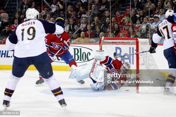 Carey Price of the Montreal Canadiens lets in a goal on a shot by Rich Peverley of the Atlanta Thrashers during the NHL game at the Bell Centre on...