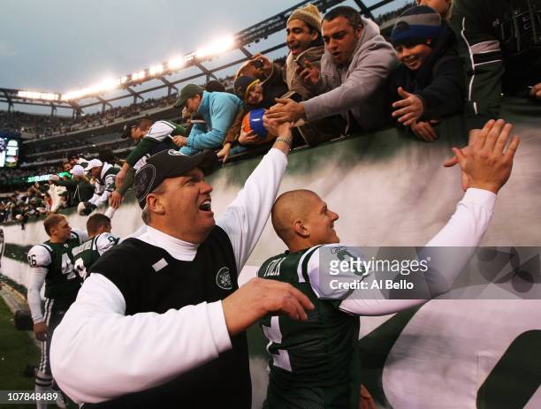 Head coach Rex Ryan and Nick Folk of the New York Jets celebrate with fans after they defeated the Buffalo Bills 38 to 7 at New Meadowlands Stadium...