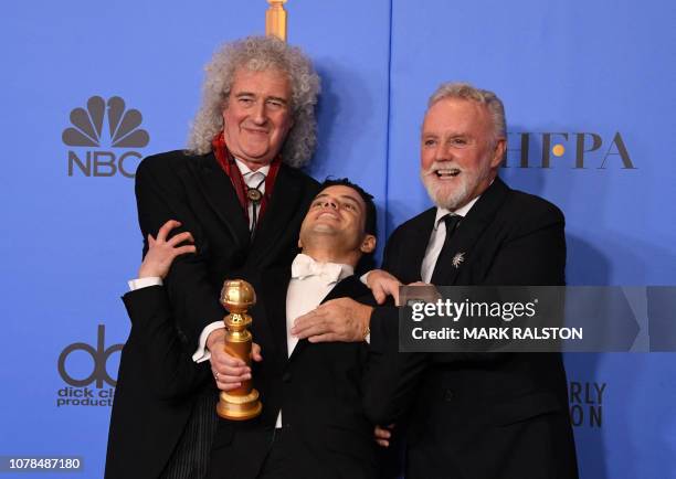 Best Actor in a Motion Picture Drama for "Bohemian Rhapsody" winner Rami Malek poses with Queen band members Roger Taylor and Brian May during the...