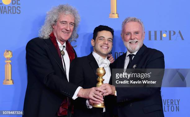 Best Actor in a Motion Picture Drama for 'Bohemian Rhapsody' winner Rami Malek with Brian May and Roger Taylor of Queen pose in the press room during...