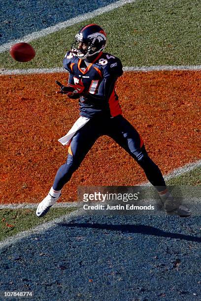 Wide receiver Brandon Lloyd of the Denver Broncos makes a touchdown reception against the San Diego Chargers during the first quarter at INVESCO...