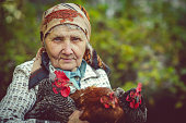Senior woman with her chicken