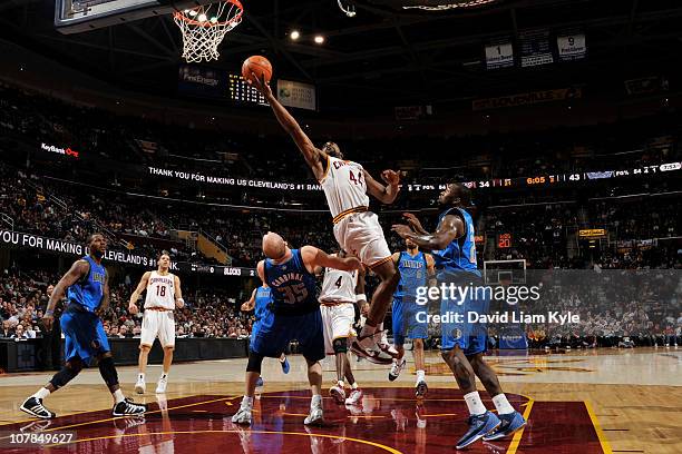 Leon Powe of the Cleveland Cavaliers shoots against Brian Cardinal of the Dallas Mavericks at The Quicken Loans Arena on January 2, 2011 in...