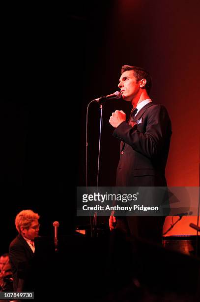 Thomas Lauderdale and NPR correspondent Ari Shapiro perform on stage with Pink Martini during the New Years Eve celebrations at Arlene Schnitzer...