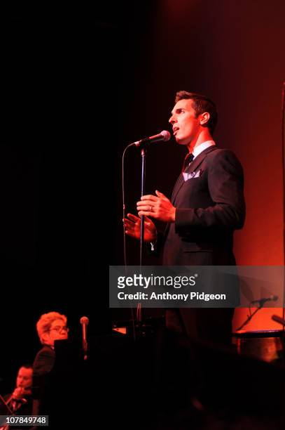 Thomas Lauderdale and NPR correspondent Ari Shapiro perform on stage with Pink Martini during the New Years Eve celebrations at Arlene Schnitzer...